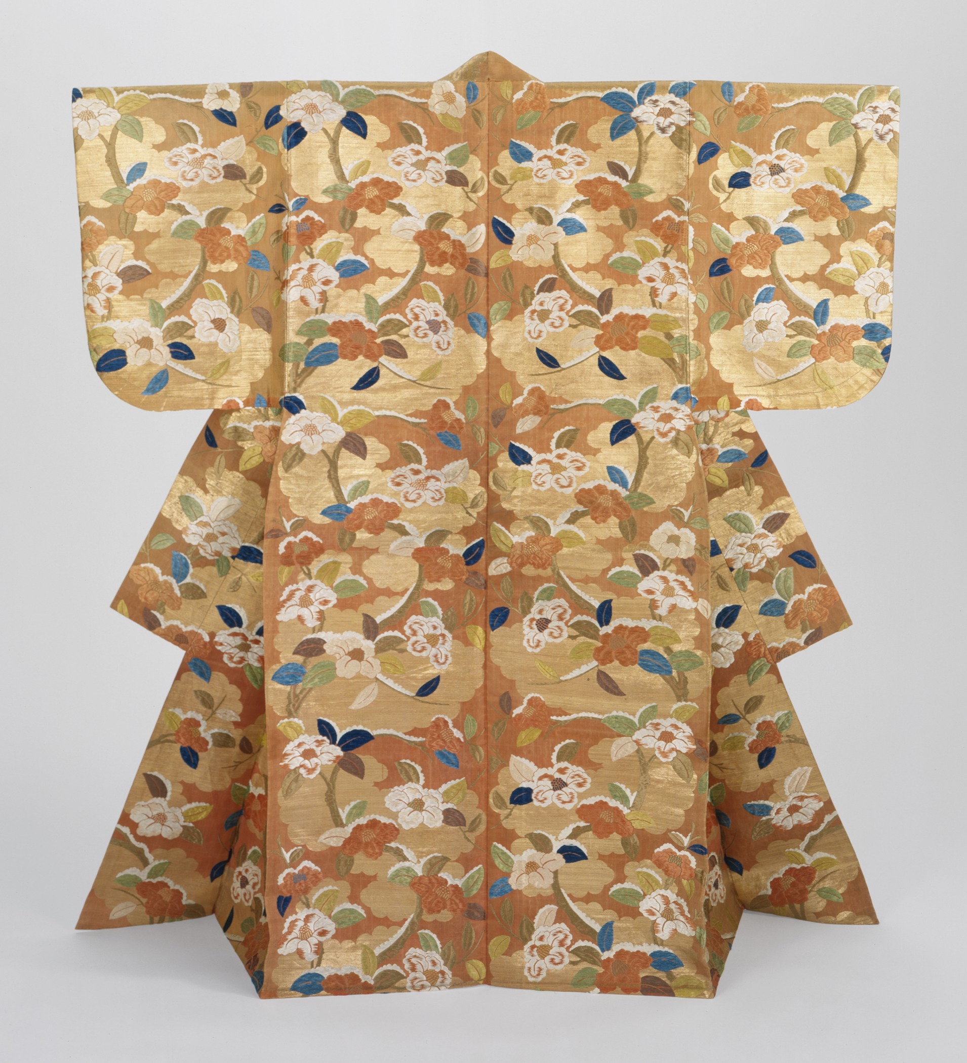 Karaori Noh robe with snow-laden camellias and Genji clouds pattern, showcasing the elaborate embroidery and symbolism in feminine Noh costumes
