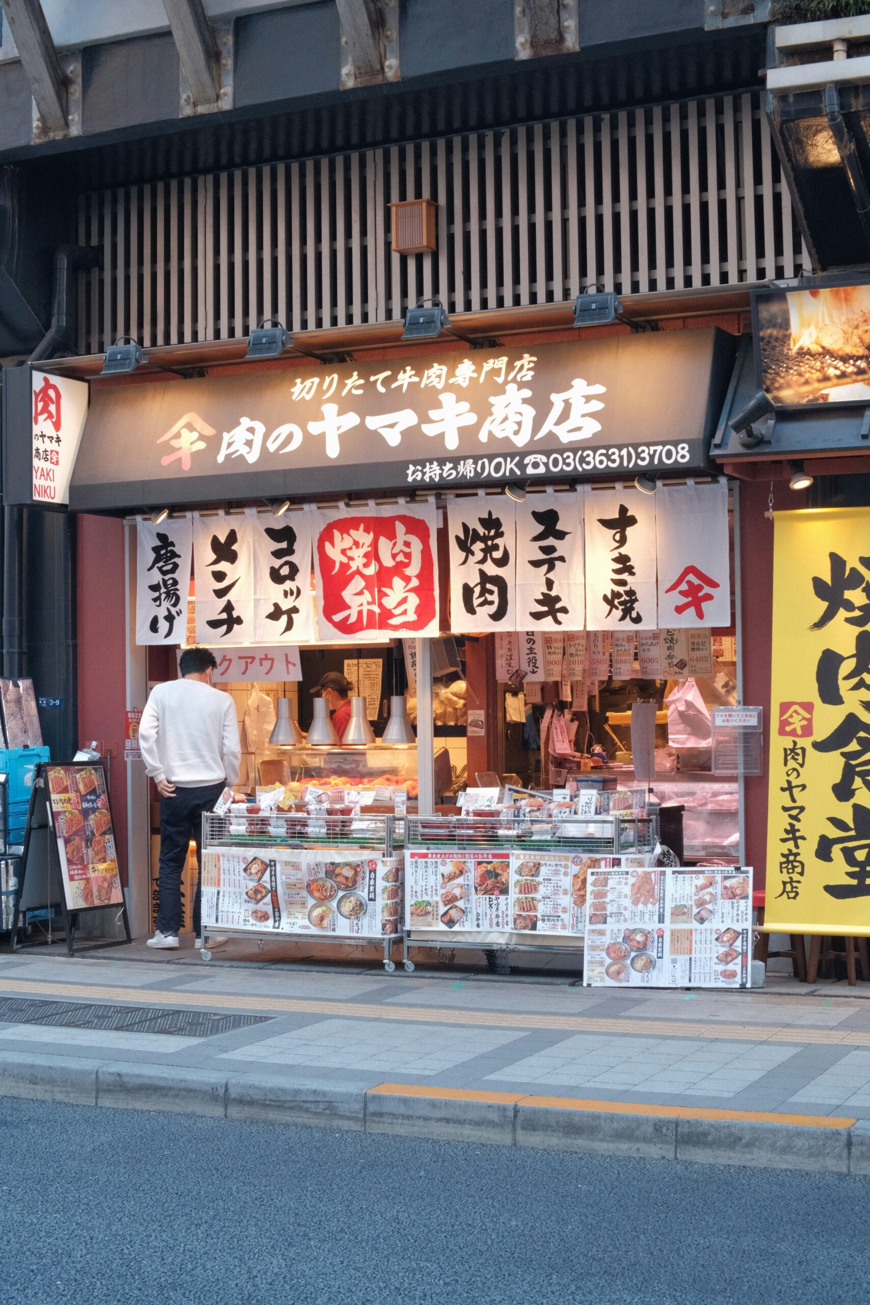 Colorful festival banners in various shades (purple, blue, red, yellow, and orange) with Japanese calligraphy
