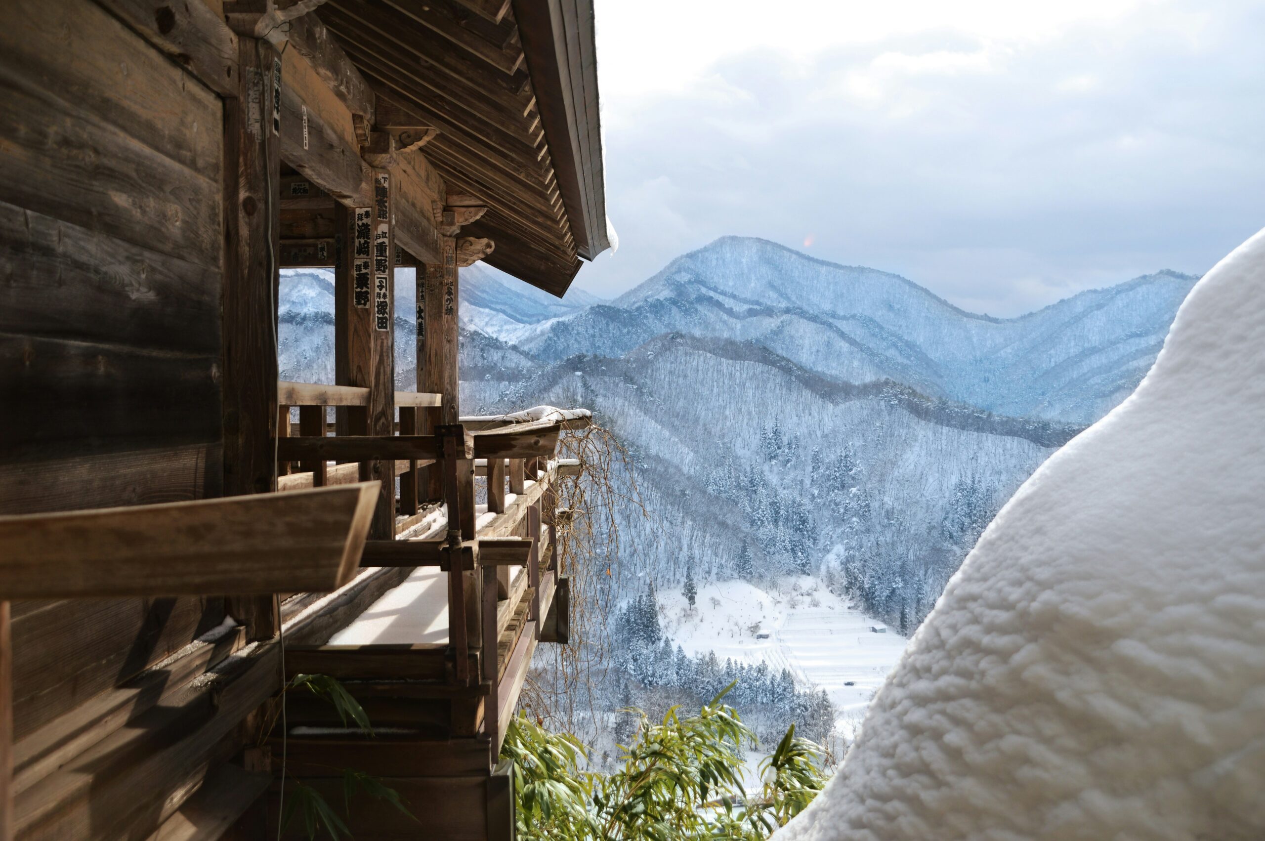 Kinkaku-ji Golden Pavilion temple in Kyoto during winter snow season, perfect backdrop for traditional kimono photography in cold weather