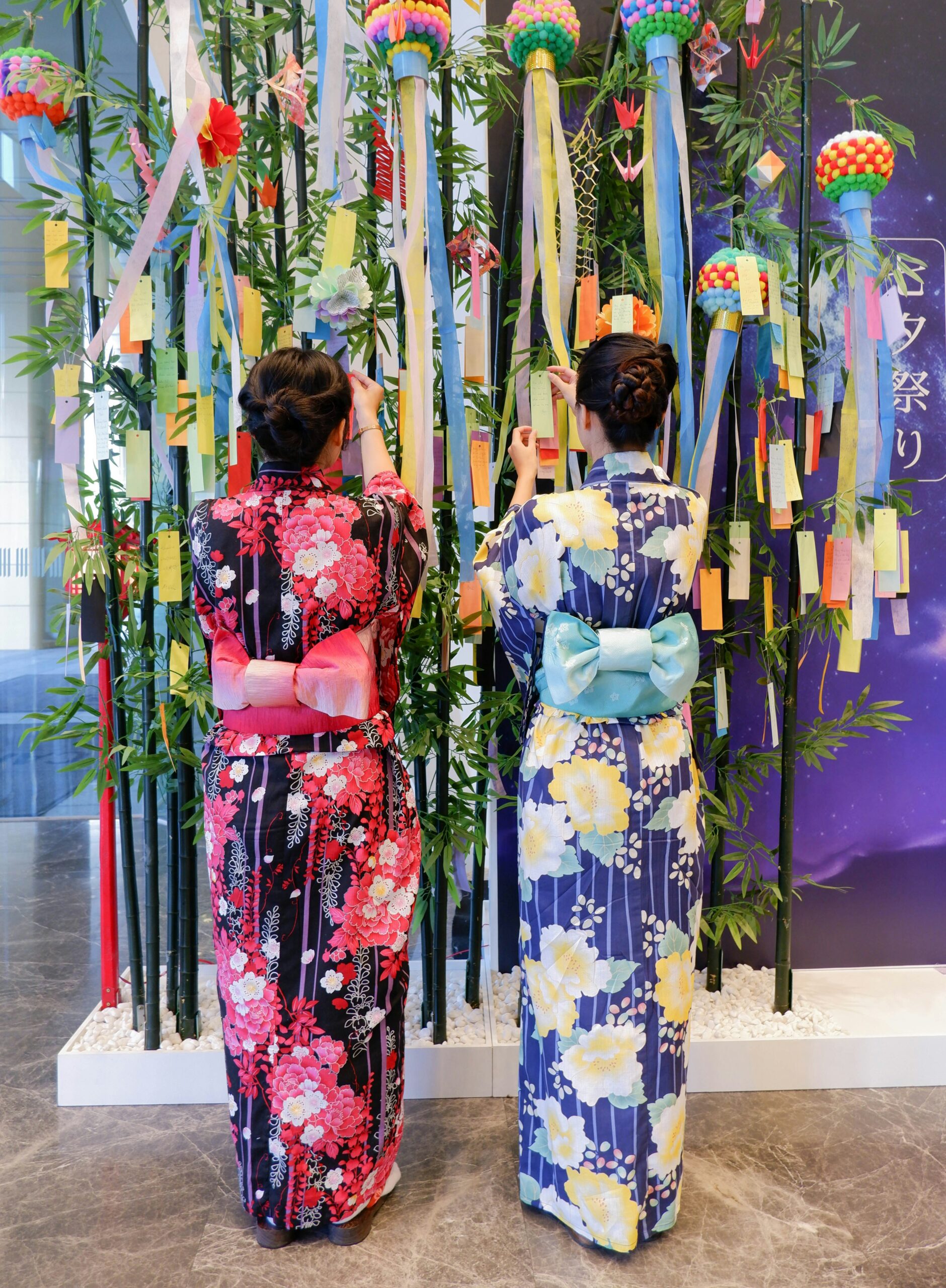 Kyoto geisha and maiko in traditional kimono displaying authentic Japanese cultural artistry in historic Gion district