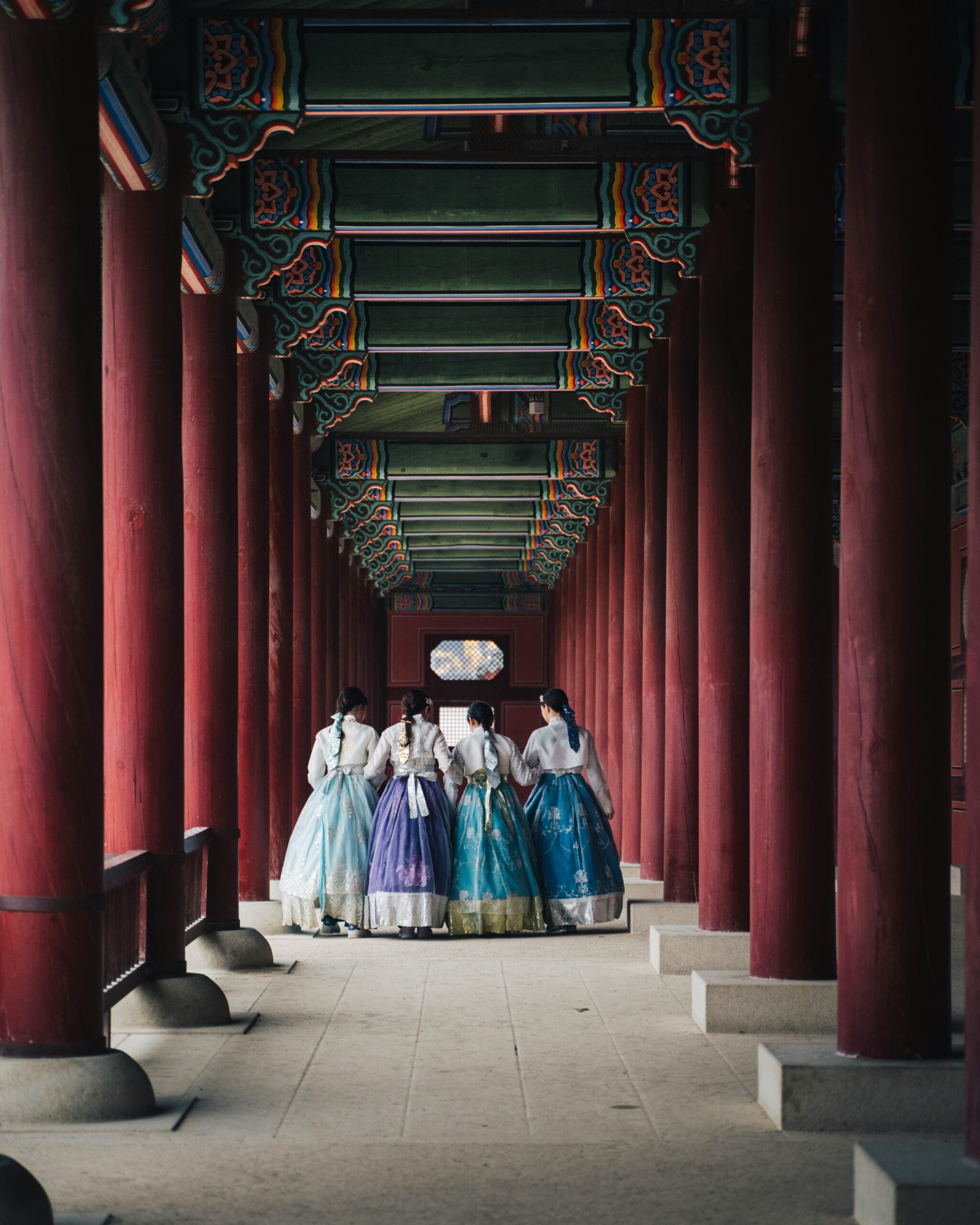 Traditional Korean hanbok dress featuring vibrant colors, high-waisted chima skirt and jeogori jacket showcasing Korean cultural heritage and craftsmanship