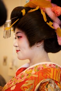 Traditional Gion geisha district in Kyoto showcasing historic streets where kimono culture thrives with wooden machiya houses and lanterns