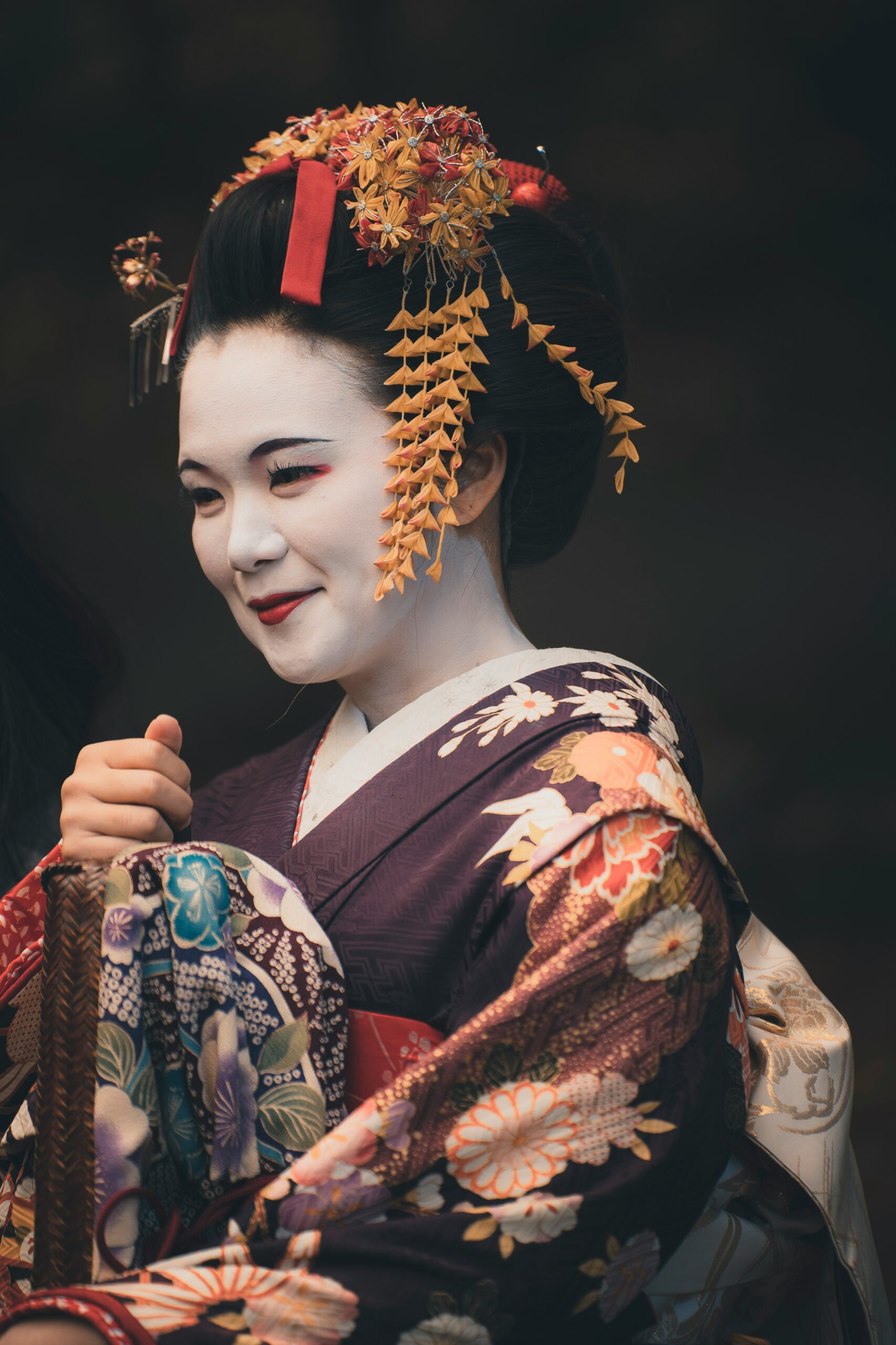 Traditional Nishijin weaving loom in Kyoto creating intricate kimono textile patterns showing centuries-old Japanese fabric artistry
