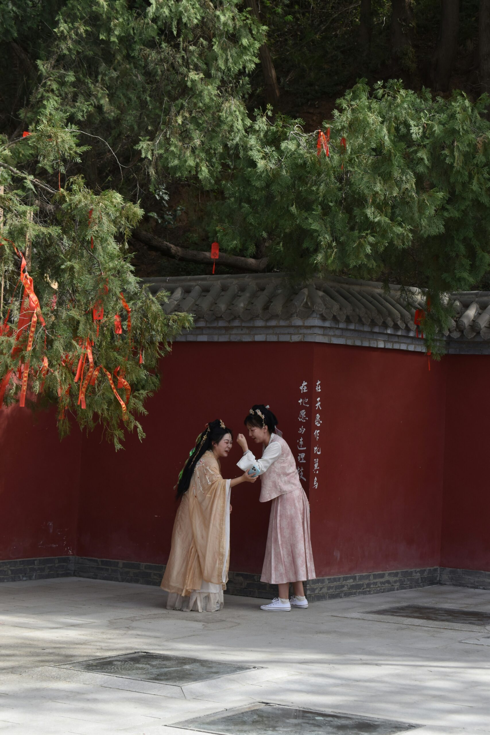 Japanese groom in traditional montsuki haori hakama wedding attire, showing the formal black kimono with family crest and pleated trousers