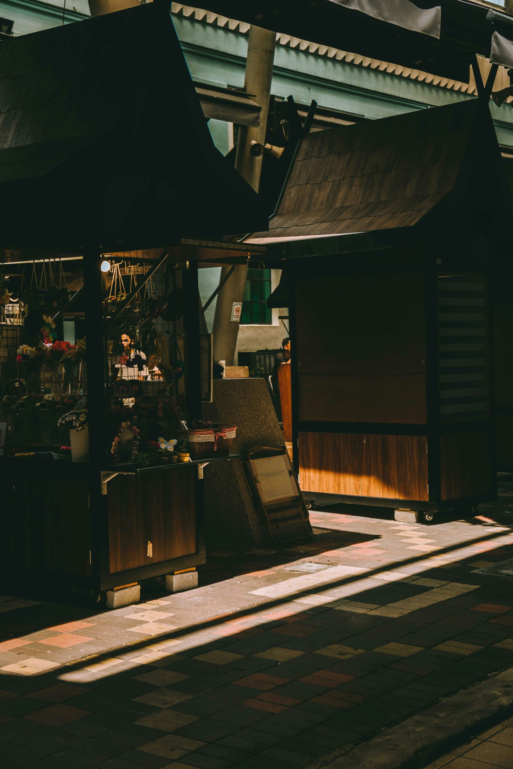 Interior of traditional kimono rental shop in Kyoto displaying colorful seasonal kimono options for tea ceremony experiences