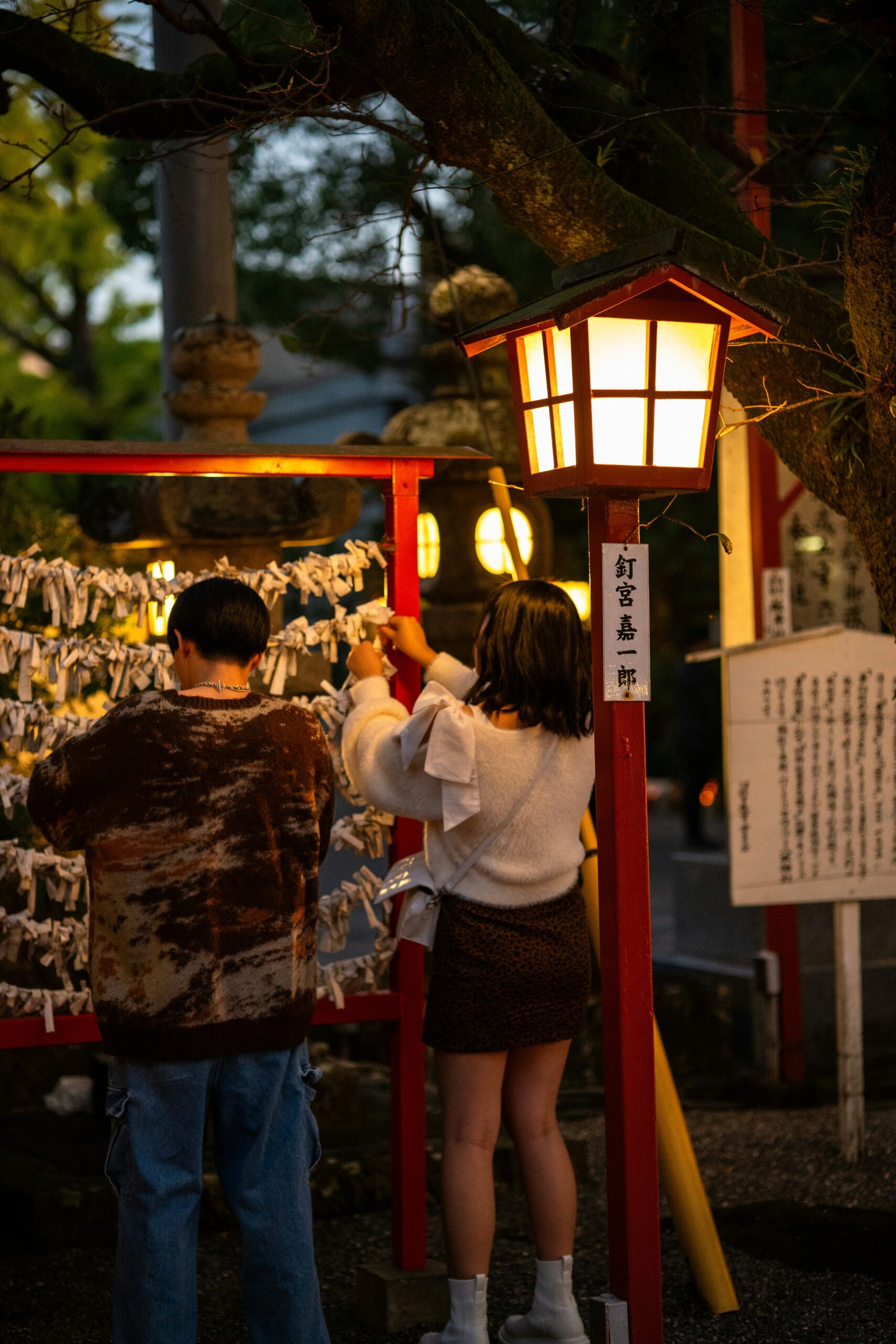 Japanese woman wearing traditional kimono visiting a shrine during New Year's Day hatsumōde ceremony in Kyoto