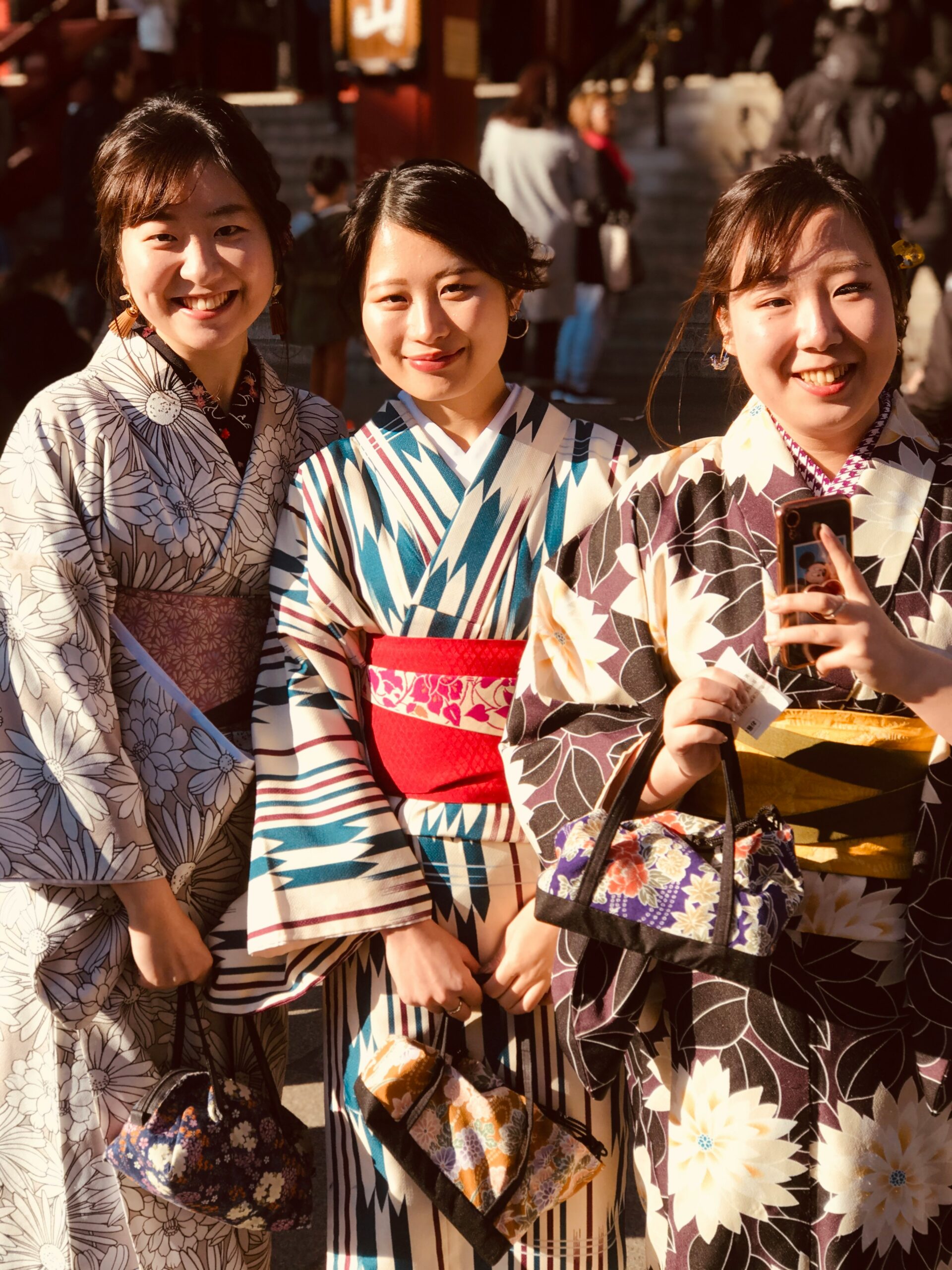 Woman in pastel homongi kimono participating in traditional Japanese tea ceremony in Kyoto Gion district with tatami and traditional tea set