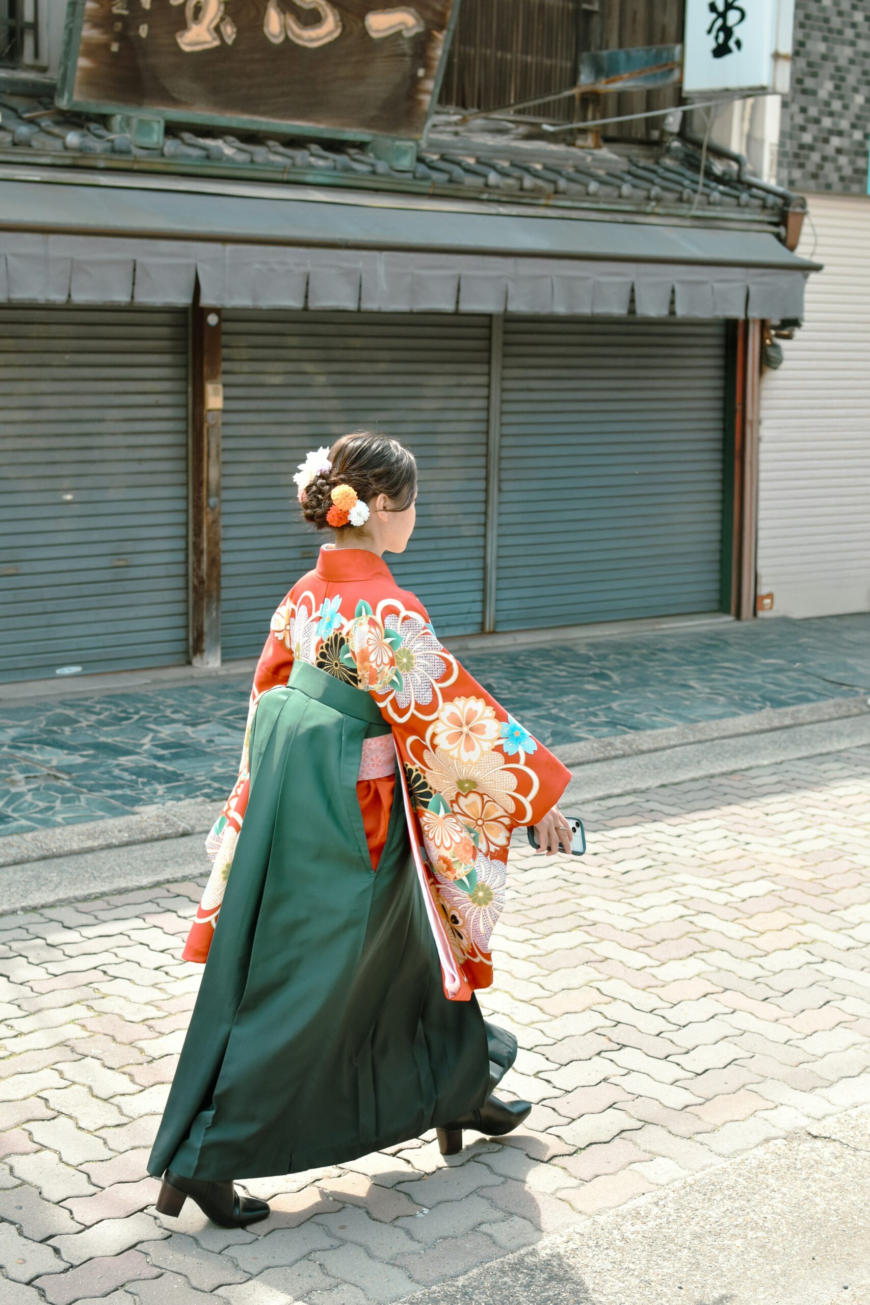 Traditional geisha and maiko in elaborate kimono walking through Kyoto's historic Gion and Pontocho districts during evening hours showcasing authentic Japanese culture