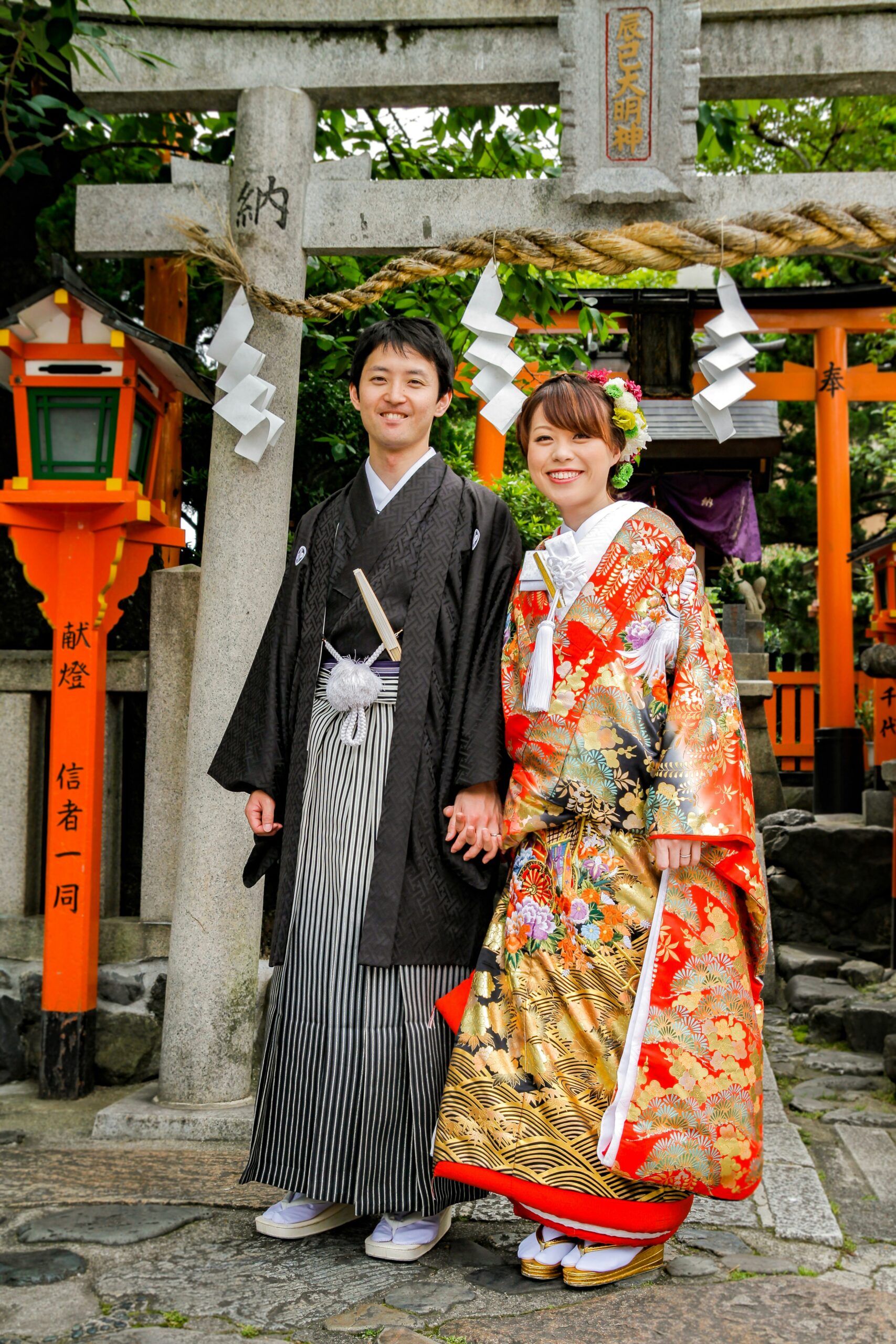 Kiyomizu-dera temple during cherry blossom season with visitors wearing traditional kimono enjoying the spring scenery at this UNESCO World Heritage Site in Kyoto