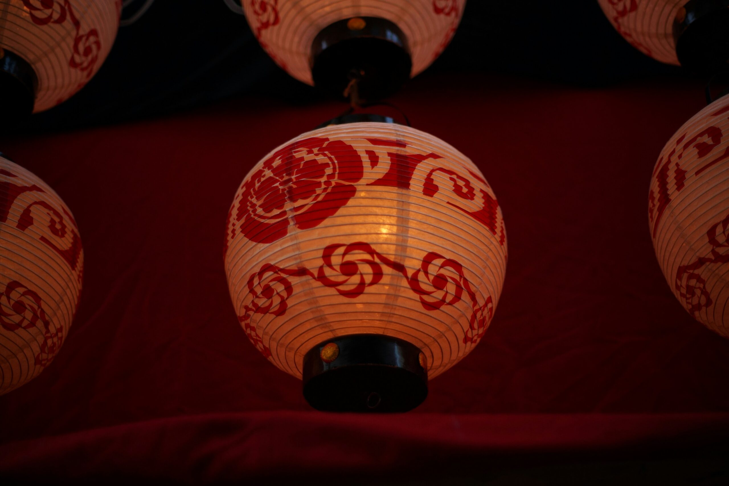 Traditional Japanese kimono accessories including colorful obi belts and decorative elements displayed for night photography in Kyoto