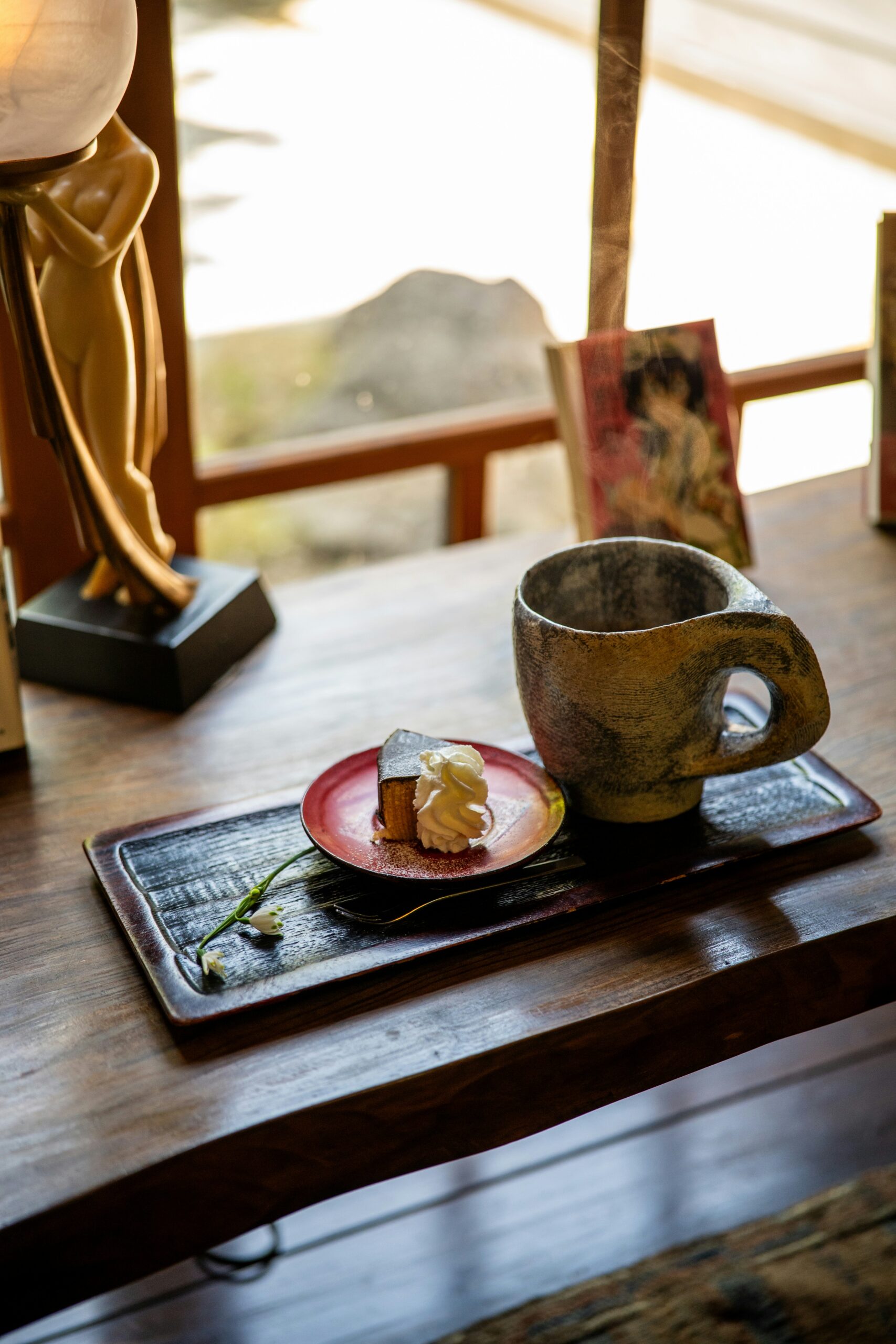 Traditional Japanese matcha latte and wagashi sweets served at authentic Kyoto cafe