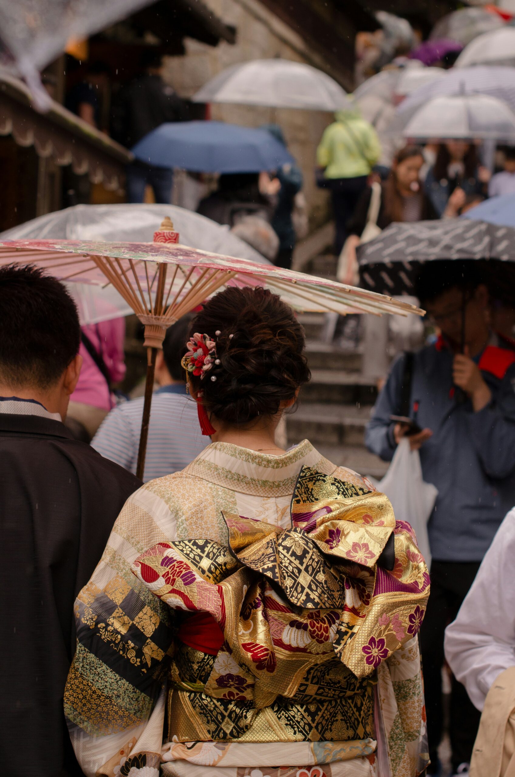 Traditional Japanese kimono back view showing detailed obi sash and knot construction, demonstrating the functional and decorative role of obi in kimono dress