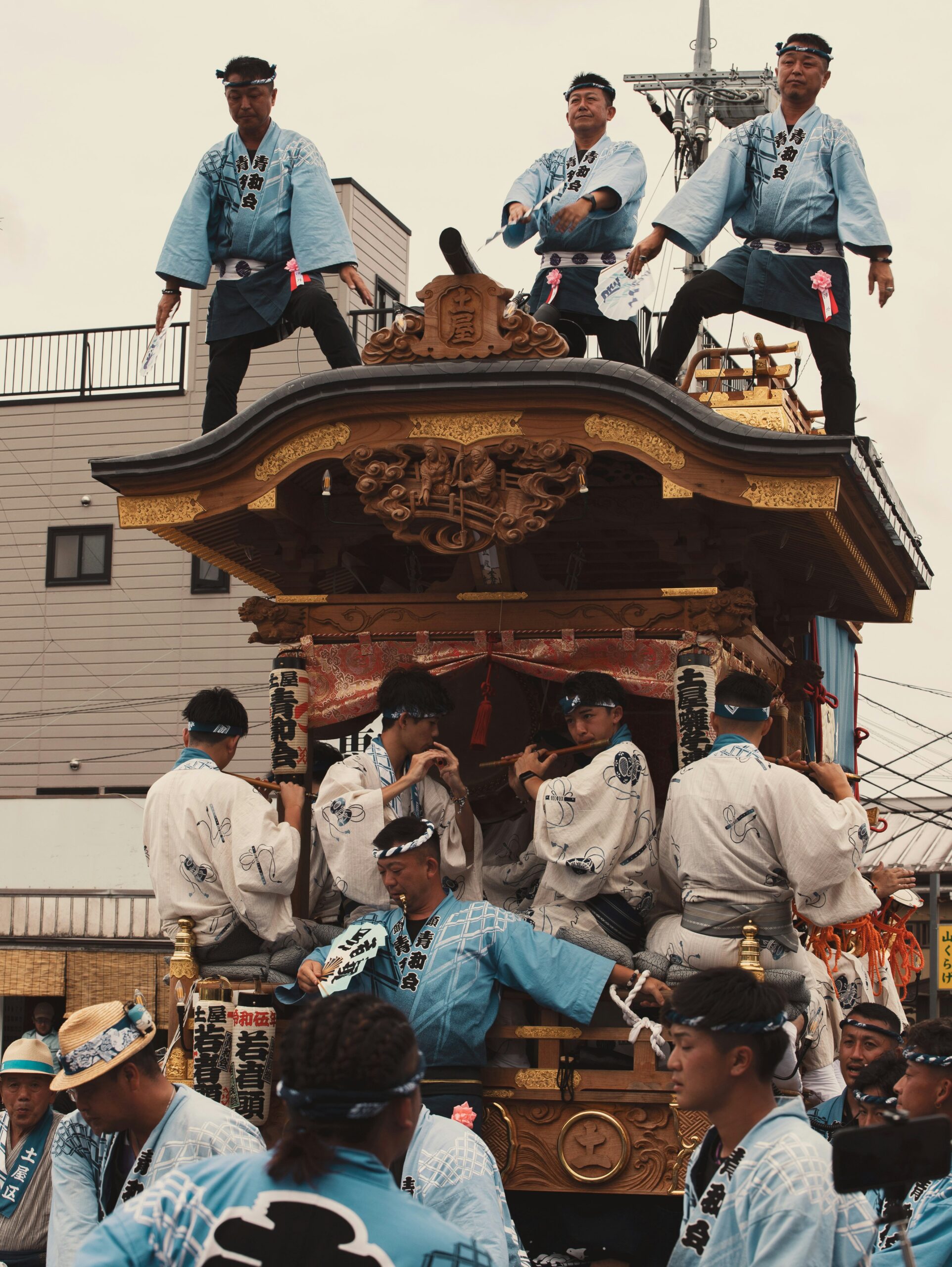 Traditional gagaku court musicians performing in ceremonial robes at Japanese shrine, demonstrating ancient cultural music and dance heritage in Kyoto