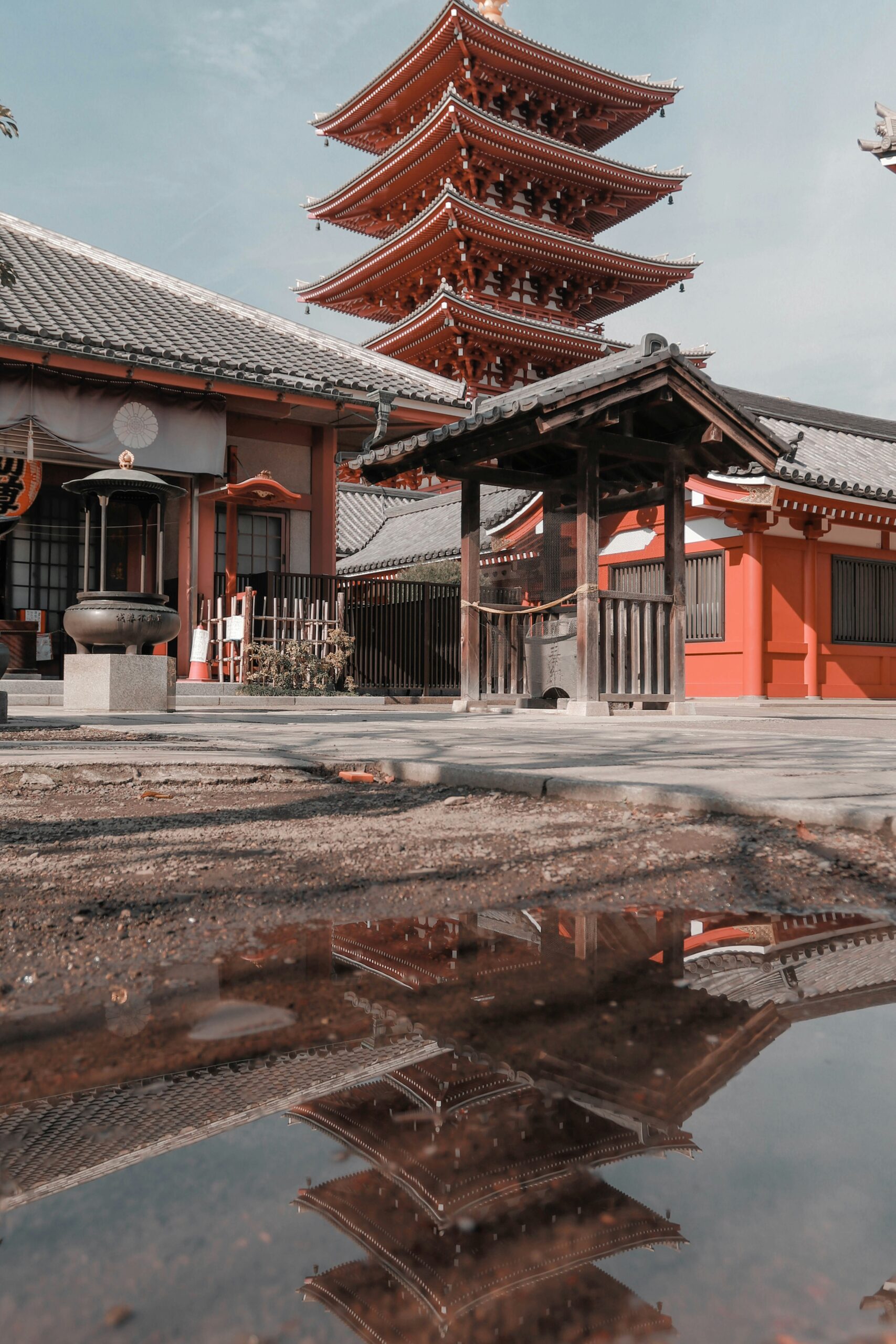 Yasaka Pagoda with wet cobblestone street reflections in Kyoto Higashiyama district after rain