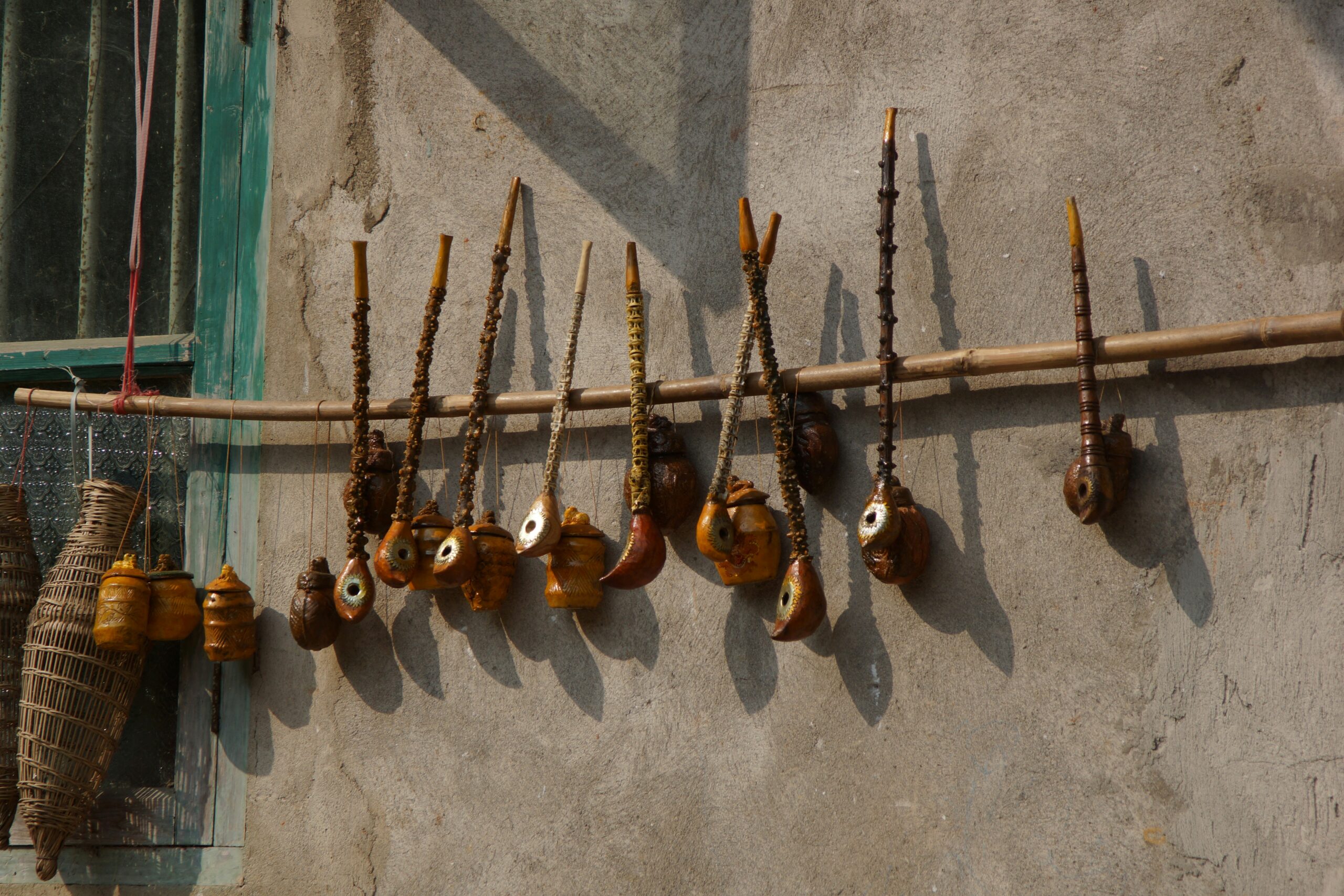 Traditional Japanese gagaku court music instruments including sho mouth organ, hichiriki double-reed flute, and biwa lute displayed for cultural performance in Kyoto