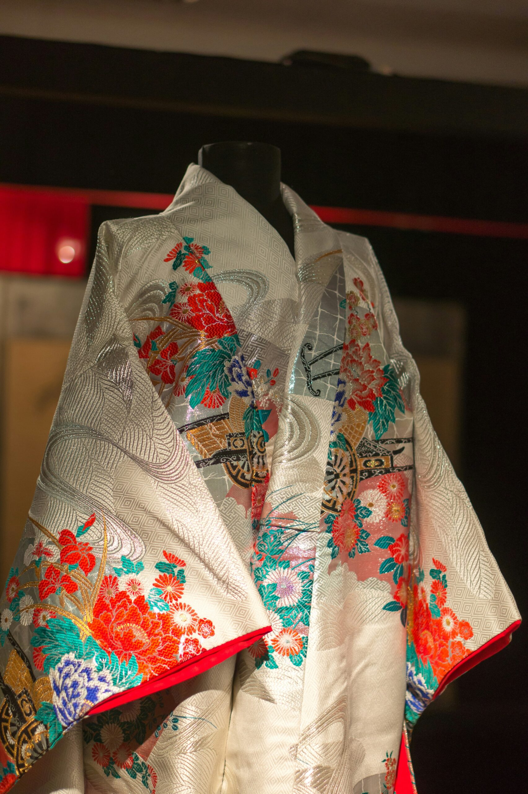 Elegant Japanese silk kimono obi fabric with intricate traditional patterns and golden details showcasing textile artistry