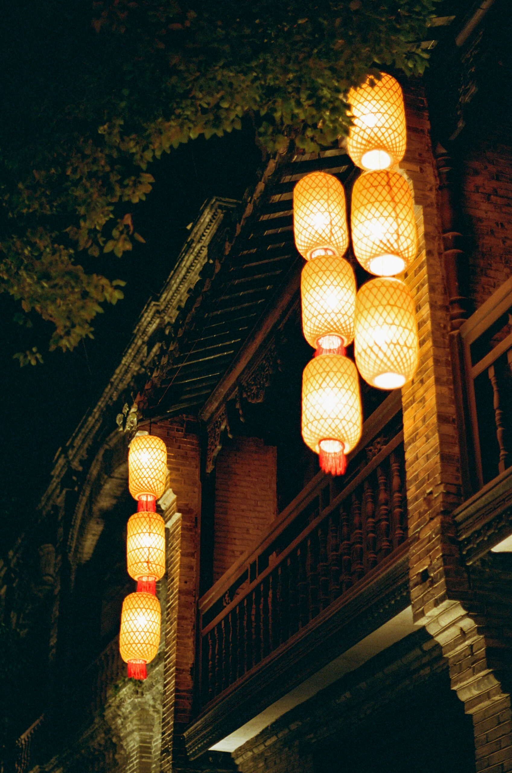 Enchanting Pontocho alley in Kyoto at dusk with traditional lanterns illuminating narrow street and traditional restaurants