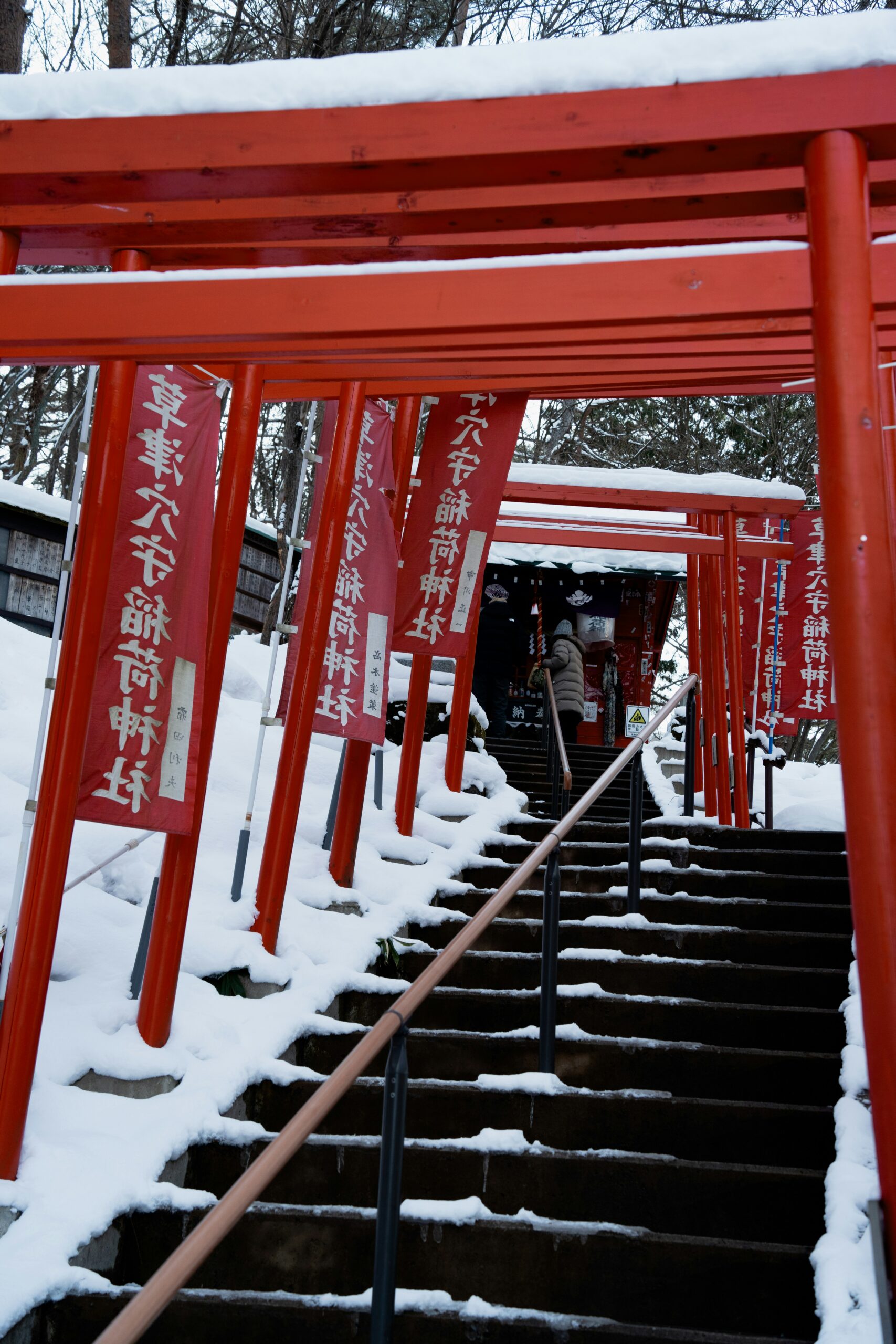 Yasaka Shrine in Kyoto with vermilion gates and snow-covered grounds, Gion Shrine winter scene with traditional Japanese architecture