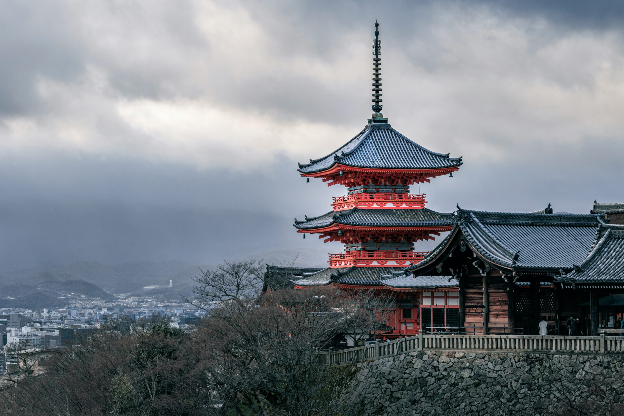 Snow-covered Kyoto temple in winter showcasing traditional Japanese architecture and serene winter landscape